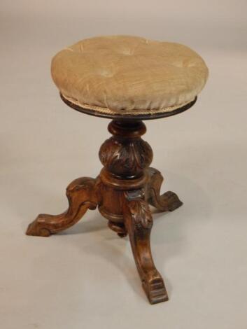 A Victorian walnut adjustable music stool