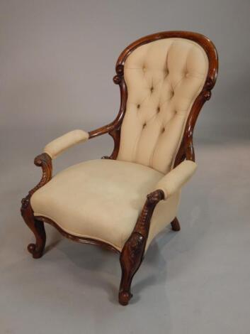 A Victorian walnut show frame armchair