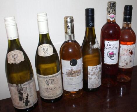 Six bottles of white and rose wine