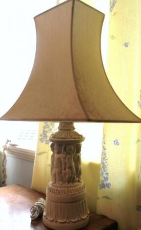 A modern figural table lamp and shade.