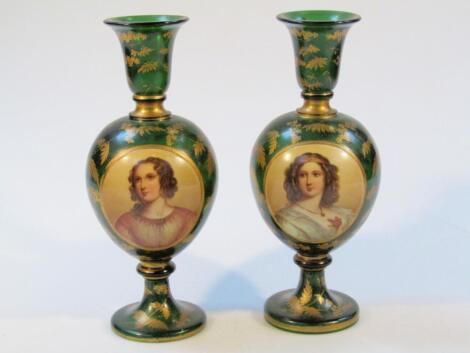 A pair of 19thC Bohemian green glass vases