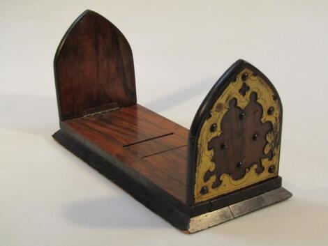 A late 19thC walnut and ebonised extending book slide