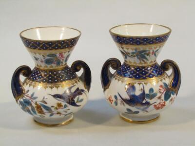 A pair of Derby style porcelain vases
