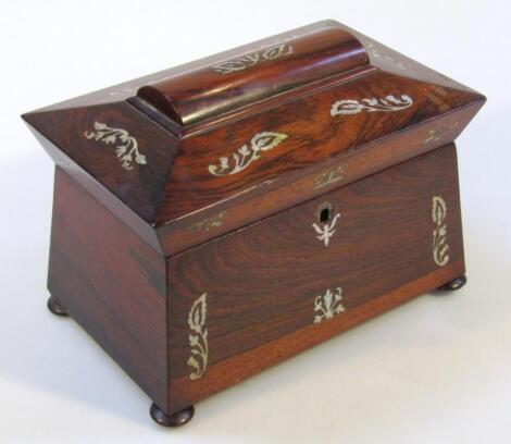 A 19thC rosewood and mother of pearl sarcophagus shaped tea caddy