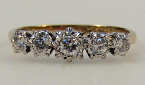 A ladies five stone diamond ring