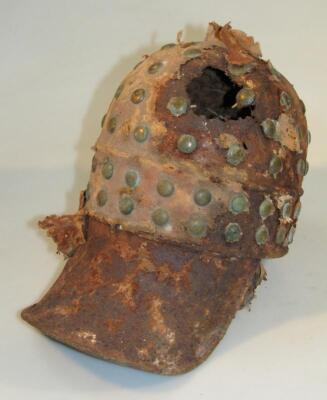 An unusual metal peaked helmet - 2