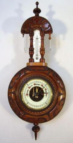 An early 20thC walnut cased barometer and thermometer