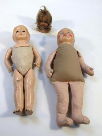 A late 19thC EP bisque headed doll