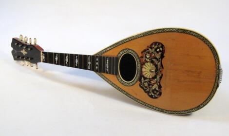 An early 20thC Italian rosewood cased mandolin