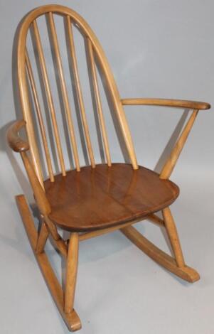 A 20thC Ercol style lightwood rocking chair