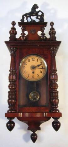 An early 20thC walnut cased wall clock