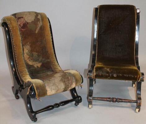 A near matching pair of open low nursing chairs