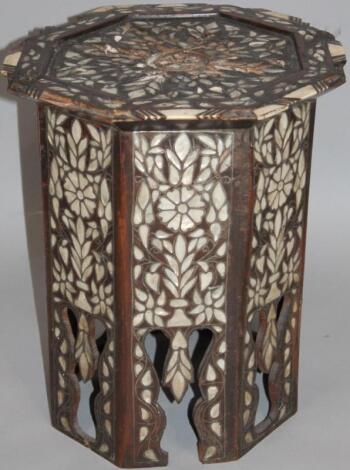 A late 19thC hardwood and mother of pearl finish occasional table