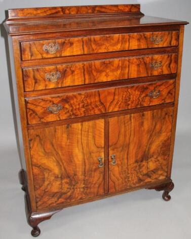 A mid-20thC walnut veneered compactum chest