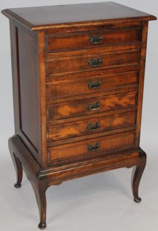 An Edwardian stained mahogany sheet music cabinet