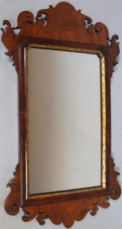 A 20thC mahogany framed wall mirror