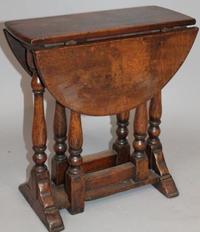 A Jacobean style oak miniature D-end table