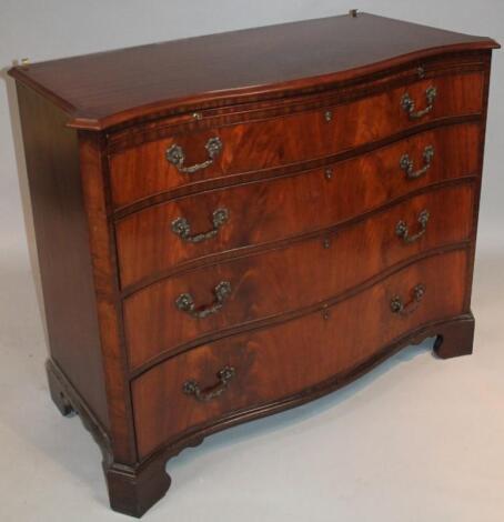 A George III style mahogany serpentine fronted chest