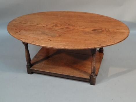 A 20thC oak Arts and Crafts design coffee table