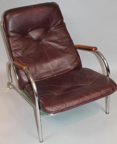 A mid-20thC retro design chrome framed armchair