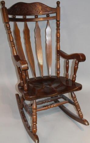 A 20thC stained beech rocking chair