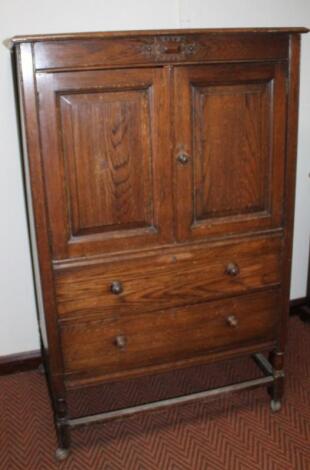 A 1920's oak compactum chest