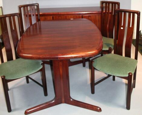 A 1960's rosewood and veneered matched dining room suite