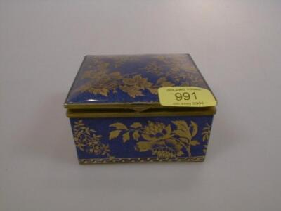 A Wedgwood porcelain trinket box having gilt floral decoration on a blue