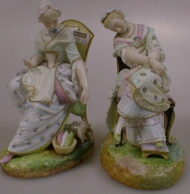 A pair of Vion Bauny polychrome bisque figures of young ladies seated on chairs