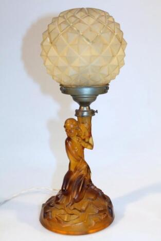 A 1930's Art Deco amber glass table lamp