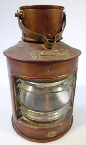 A 20thC copper and brass SWMF Stern ships style lamp