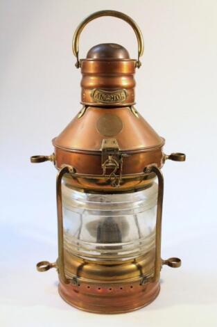 A large ships copper and brass mast lamp