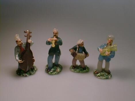 Nine Venetian glass figures all playing musical instruments