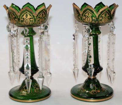 A pair of late 19thC/early 20thC green glass lustres