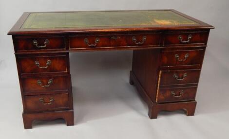 A reproduction mahogany Georgian style kneehole desk