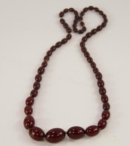 An amber beaded necklace.