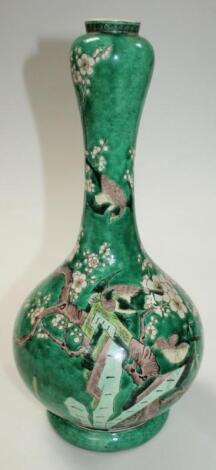 A 19thC Chinese Qing period earthenware bottle vase