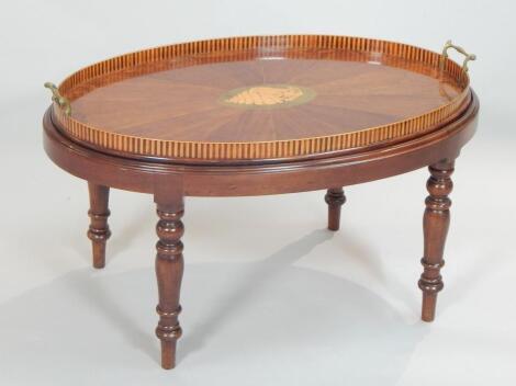 A late 19thC Sheraton Revival oval mahogany and amboyna tea tray