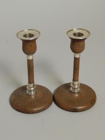 A pair of Victorian silver and brown snakeskin leather candlesticks