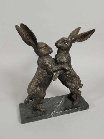 20thC British School. A pair of hares fighting