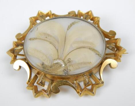 A Victorian gilt metal memorial brooch
