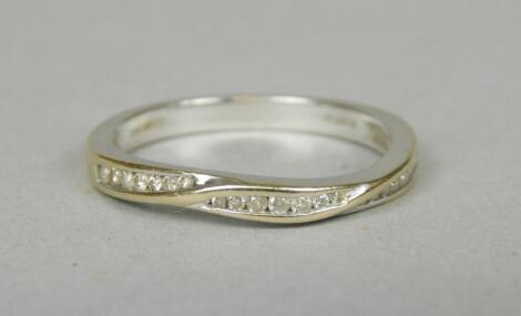 An 18ct white gold (import) diamond set half hoop eternity ring