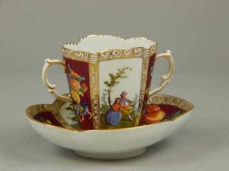 An early 20thC Dresden porcelain two handled cabinet cup and saucer