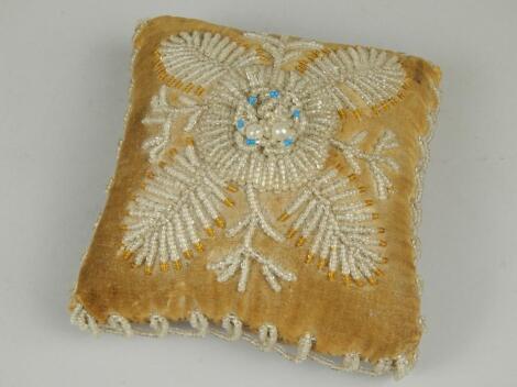 A Victorian square beadwork cushion