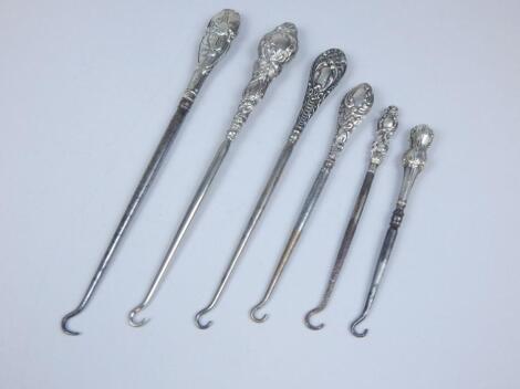 Five late 19th/early 20thC silver mounted button hooks