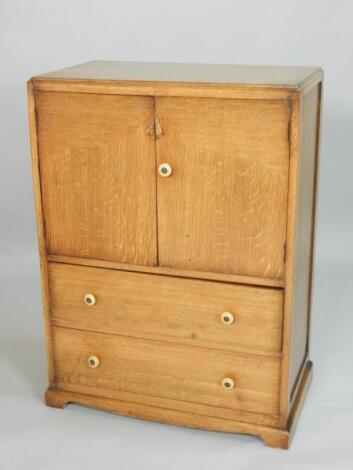 An Art Deco style oak cabinet