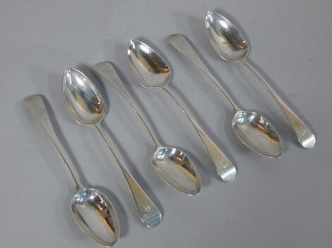 A set of six silver dessert spoons