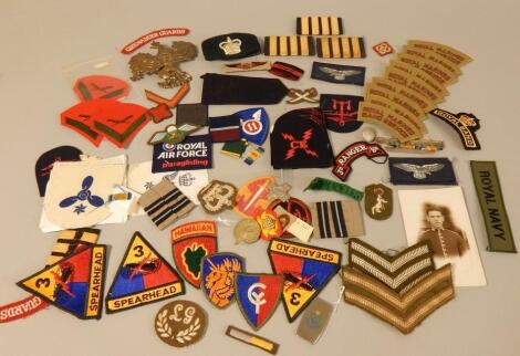 A large quantity of regimental cloth badges