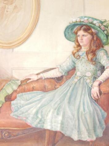 H.S. An Edwardian young lady in a green dress seated on a chaise longue