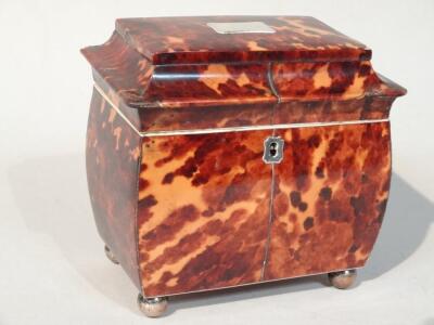 An early Victorian tortoiseshell bombe tea caddy